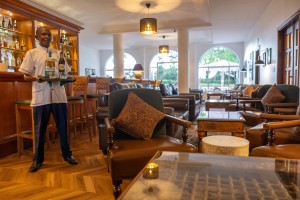 The wood-panelled 1950s Bar, with its herringbone floor, leather seating, framed prints and shelved spirits.