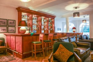 The wood-panelled 1950s Bar, with its herringbone floor, leather seating, framed prints and shelved spirits.