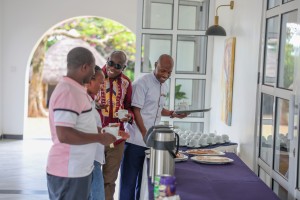 Delegates helping themselves at the tea and coffee station during a break.