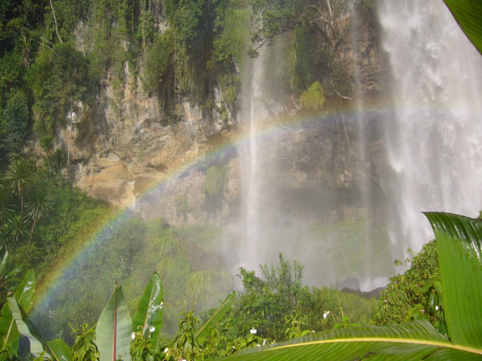 A rainbow in the spray at the foot of one of the Sipi waterfalls.