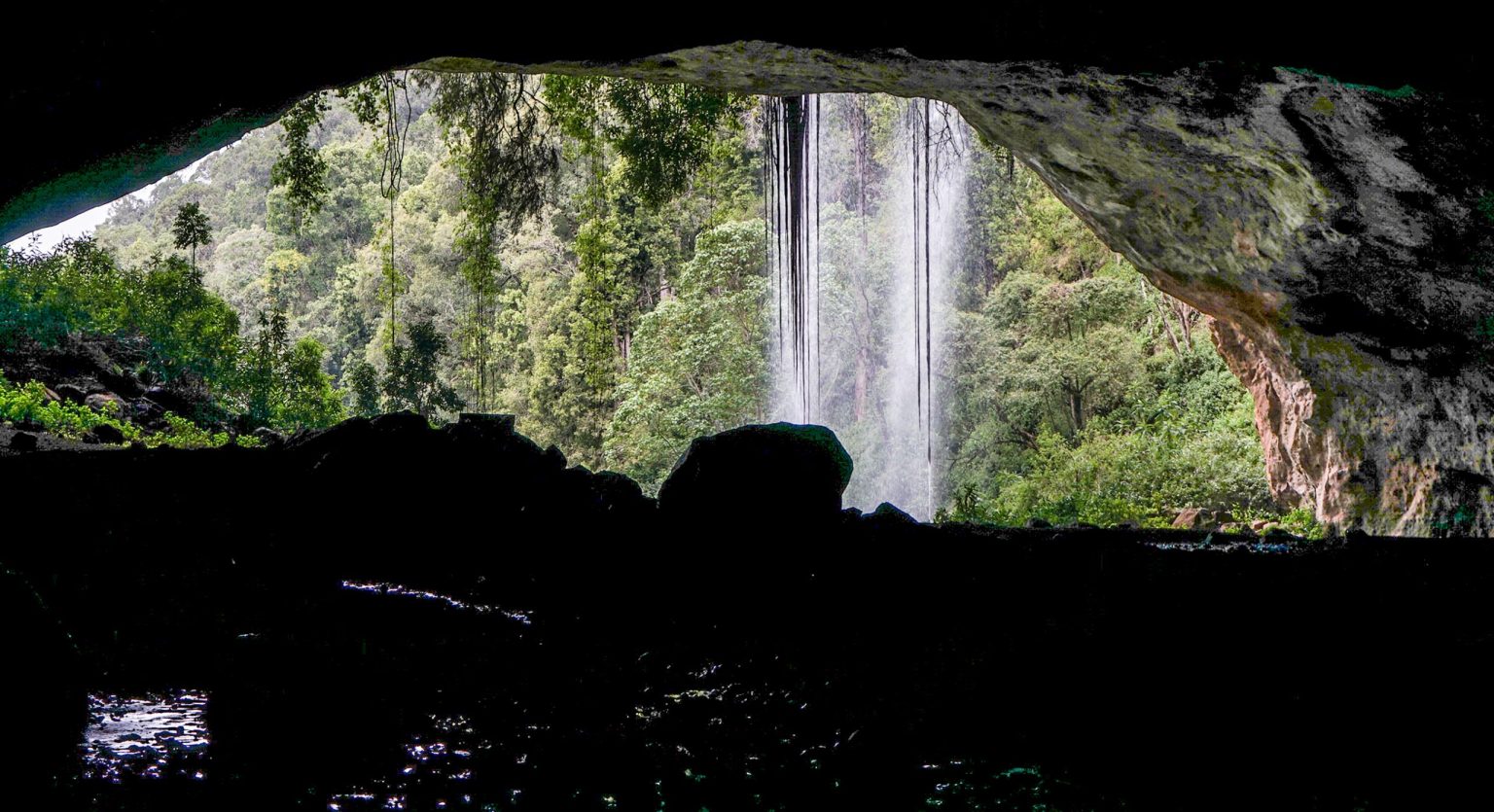 A waterfall seen from inside the cave behind the falling water in Mount Elgon National Park.
