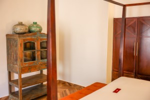 The separate lounge of a suite, with sofa, armchairs and a low round table.